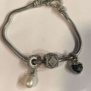 udith Ripka Charm Bracelet with three charms. Silver (925) and CZ.